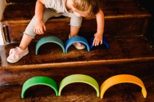 Child playing independently with the Montessori Grimms Rainbow